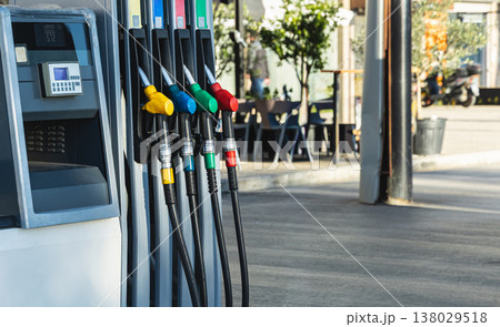 Colored Fuel nozzles at the petrol pump or gas station. Different types of fuel pumps 138029518