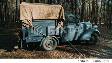Vintage German military truck parked in forest during World War II Vintage German military truck parked in forest during World War II 138029609