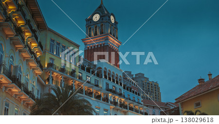 Sunset Town, Phu Quoc, Vietnam. Sunset Town Clock Tower with Pastel Colonial Facades and Glowing Public Sculpture, 138029618
