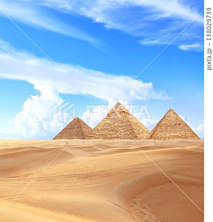 Famous Great Pyramids of Menkaure, Chephren and Cheops, Cairo, Egypt. Three iconic Great Pyramids and beautiful sand dunes, Giza Necropolis, have become a popular destination for travellers 138029739