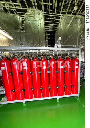 Bright red oxygen cylinders have been fitted aboard the vessel, standing out against the metal and machinery of the ship. 138030118