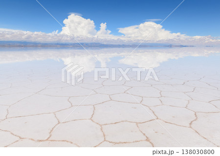Peaceful Salar de Uyuni salt flat in Bolivia with sky reflection Peaceful Salar de Uyuni salt flat in Bolivia with sky reflection 138030800
