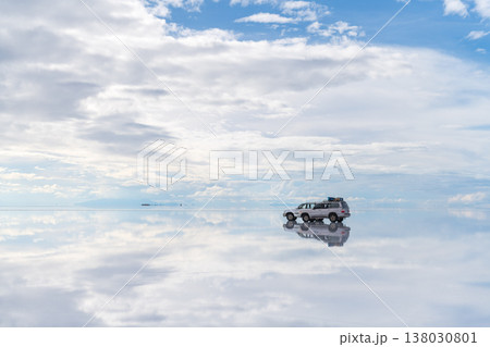Dreamlike car reflection on endless salt flat of Uyuni Bolivia Dreamlike car reflection on endless salt flat of Uyuni Bolivia 138030801