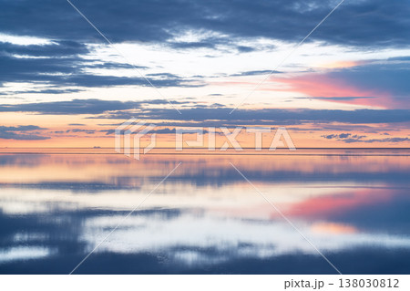 Serene sunset sky reflection on salar water in Uyuni Bolivia 138030812