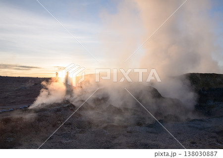 Dramatic geothermal sol de manana geyser field with steam at sunrise 138030887