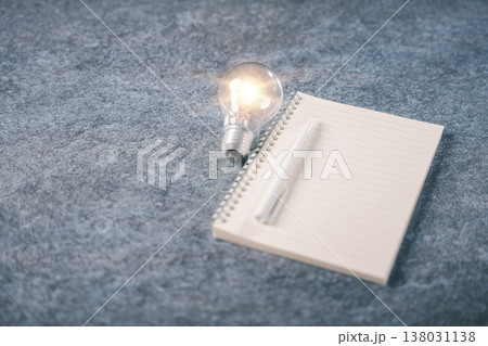 Bright bulb light shows creative idea concept, knowledge for education, blank book notebook with pen helps people learn, learning innovation and business training inspires growth Bright bulb light shows creative idea concept, knowledge for education, blank book notebook with pen helps people learn, learning innovation and business training inspires growth 138031138