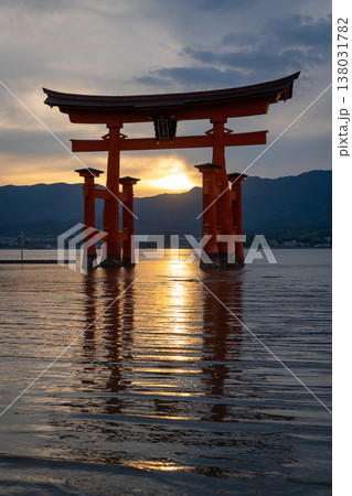 Famous red torii gate of Itsukushima shrine at sunset in Miyajima, Japan 138031782