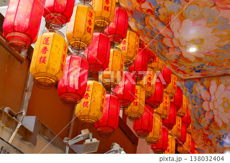 Traditional red and orange Chinese lanterns displayed in rows for festive decoration in Hong Kong market Traditional red and orange Chinese lanterns displayed in rows for festive decoration in Hong Kong market 138032404