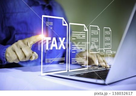 Tax concept with digital tax documents and businessman working on laptop for accounting and finance Tax concept with digital tax documents and businessman working on laptop for accounting and finance 138032617