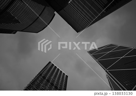 Skyscrapers in Hong Kong financial district, modern office towers architecture in black and white Skyscrapers in Hong Kong financial district, modern office towers architecture in black and white 138033130
