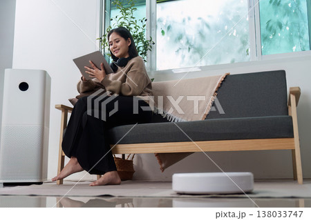 Woman relaxing with a tablet and smart devices 138033747