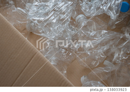 plastic recycling stream: pet bottles gathered as valuable secondary raw material in box 138033923