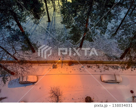 Aerial view of snow covered park and street at winter twilight. High quality photo Aerial view of snow covered park and street at winter twilight. High quality photo 138034031