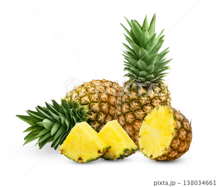 Group of pineapples and slices isolated. Fresh ripe pineapple and cut in a half with slice isolated. Group of pineapples and slices isolated. Fresh ripe pineapple and cut in a half with slice isolated. 138034661