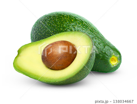 Fresh green Fuerte avocado and half of avocado with seed isolated. Avocados with clipping path. Fresh green Fuerte avocado and half of avocado with seed isolated. Avocados with clipping path. 138034667
