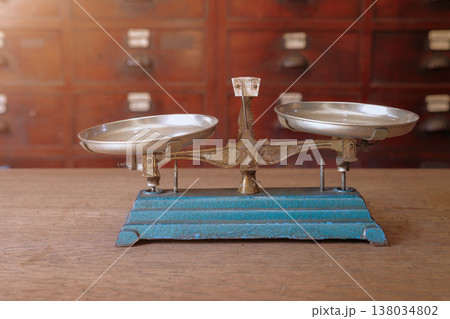 old scales, weight balance with Thai Indian Chinese herbs drawer cabinet shop background old scales, weight balance with Thai Indian Chinese herbs drawer cabinet shop background 138034802