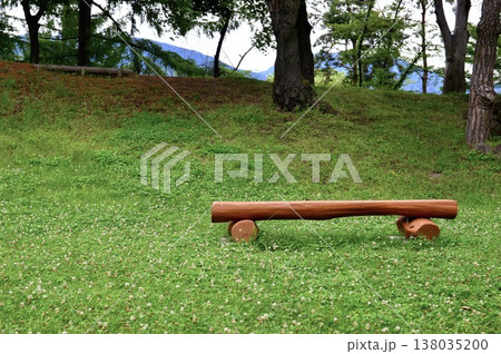 Relaxing log bench for forest bathing wellness. 138035200