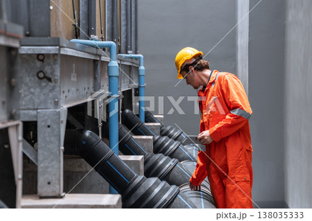 Professional plumbing pipe, Water cooling system engineer man working check large water pipeline. 138035333