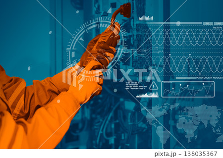 Electrician engineer worker testing electric cable at main power line cabinet fuse box. 138035367