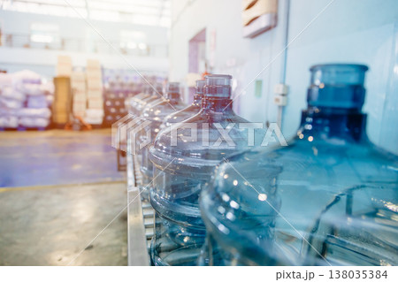 drinking water clean gallon bottles at drinking water factory waiting in line for filling in plant. 138035384