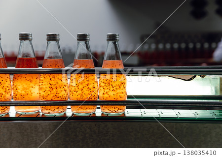 Drink factory production line fruit juice beverage product at conveyor belt. Drink factory production line fruit juice beverage product at conveyor belt. 138035410