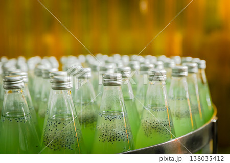 Drink factory production line fruit juice beverage product at conveyor belt. Drink factory production line fruit juice beverage product at conveyor belt. 138035412