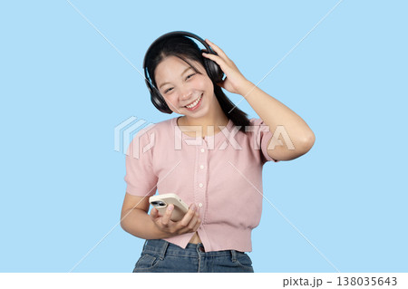 young teen girl happy smile enjoy music from phone, listening music by headphone studio isolated young teen girl happy smile enjoy music from phone, listening music by headphone studio isolated 138035643