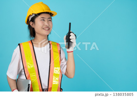 Portrait Engineer Woman Asian Teen with safety reflective vest isolated model on duty radio operate Portrait Engineer Woman Asian Teen with safety reflective vest isolated model on duty radio operate 138035805