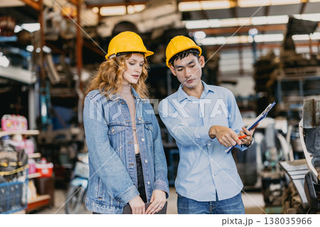 Technician male worker working in garage scrap yard old car part workshop warehouse Technician male worker working in garage scrap yard old car part workshop warehouse 138035966