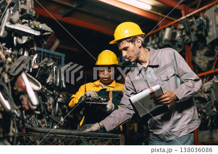 African women with engineer man staff worker working heavy industry old part warehouse 138036086