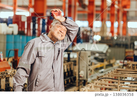 Tired stress senior worker, old man engineer hard working in heavy industry health problem from hot 138036358