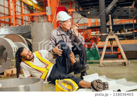 Accident worker in workplace, young man down leg injury senior supervisor emergency medical help 138036403