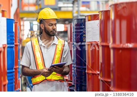 African black male worker working check in chemicals storage in petrochemical oil gas plant factory 138036410