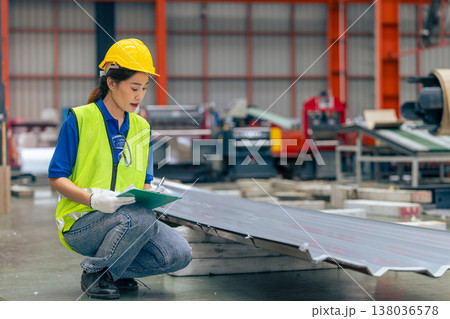 Asian woman engineer worker, professional employee working in metal sheet plant factory Asian woman engineer worker, professional employee working in metal sheet plant factory 138036578