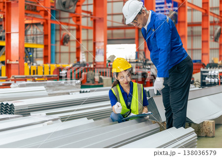 women worker working in plant factory with senior supervisor training checking work order women worker working in plant factory with senior supervisor training checking work order 138036579