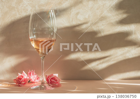 Rose Wine Glass with Pink Roses. Romantic Still Life with Shadows. Rose Wine Glass with Pink Roses. Romantic Still Life with Shadows. 138036750