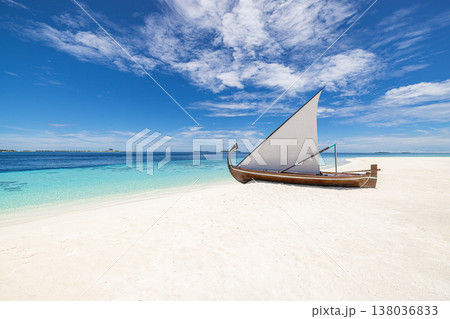 Old wooden sailboat decoration on white sandy beach with ocean view, tropical Maldives style, rustic marine decor, sunny summer vacation background Old wooden sailboat decoration on white sandy beach with ocean view, tropical Maldives style, rustic marine decor, sunny summer vacation background 138036833