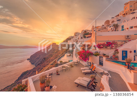 Sunset over Santorini Greece caldera, sun beds and flowers, idyllic romance, honeymoon couple, love travel destination, tourism background 138036854