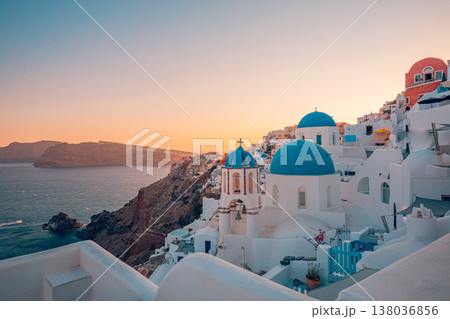 Oia Santorini Greece sunset panorama, iconic blue domes, dreamy clouds, summer vacation, romantic European travel scene 138036856
