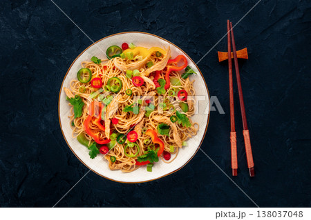 Chow Mein noodles with chicken and vegetables, overhead flat lay shot Chow Mein noodles with chicken and vegetables, overhead flat lay shot 138037048