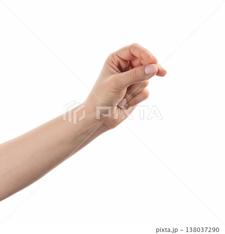 Young woman hand holding something like a business card with fingers isolated on white background Young woman hand holding something like a business card with fingers isolated on white background 138037290