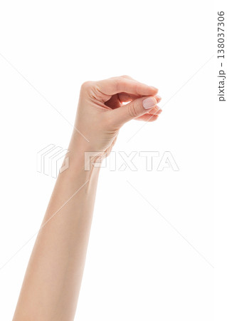 Young woman hand holding something with fingers isolated on white background Young woman hand holding something with fingers isolated on white background 138037306