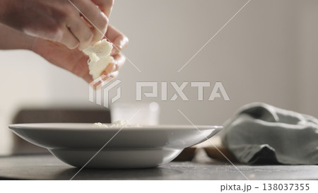add mozzarella cheese to pasta into plate closeup add mozzarella cheese to pasta into plate closeup 138037355