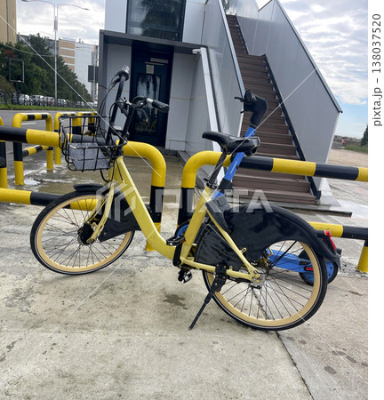 bike on the sidewalk. rent transport concept. healthy lifestyle bike on the sidewalk. rent transport concept. healthy lifestyle 138037520