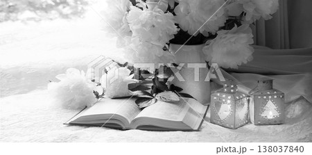 Flowers and book on the table 138037840