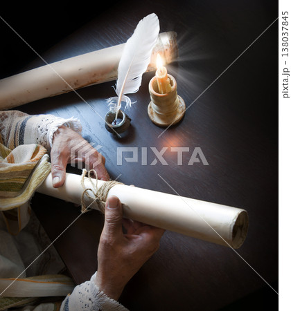 Man holding an old scroll 138037845