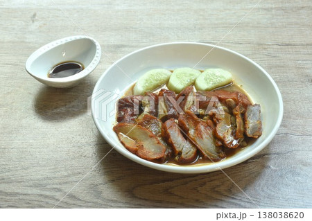 roasted duck meat and red barbecue pork with cucumber dressing sweet gravy soy sauce on plate 138038620