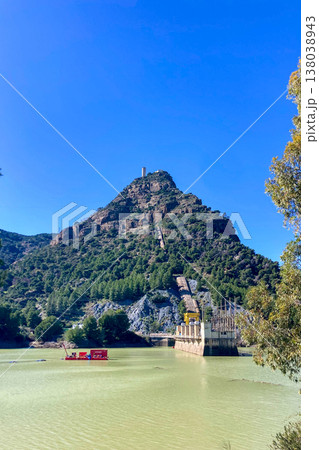 Scenic Guadalhorce reservoirs filled to the brim with water creating breathtaking natural landscape in Spain. Scenic Guadalhorce reservoirs filled to the brim with water creating breathtaking natural landscape in Spain. 138038943