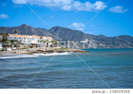 Wonderful landscapes of the shimmering sea and charming city unfold, offering breathtaking coastal views and a picturesque atmosphere in Nerja, Spain Wonderful landscapes of the shimmering sea and charming city unfold, offering breathtaking coastal views and a picturesque atmosphere in Nerja, Spain 138039168
