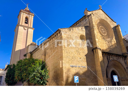 Enjoying historic architecture while walking through charming streets and urban spaces in Cordoba, Spain. 138039269